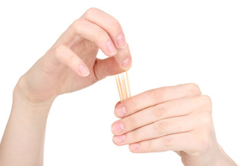 Hand throwing toothpick isolated on white