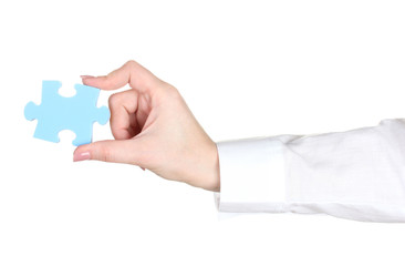 Fototapeta premium woman hand holding puzzle isolated on white