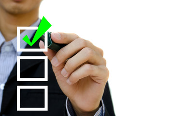 Young business hand with pen mark the check boxes.