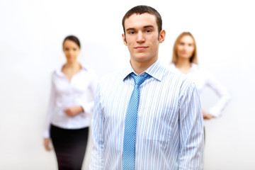 three successful young business persons together