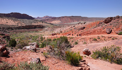 Hikers on a trail in Arches National Park, Utah