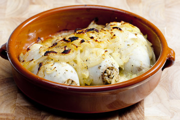 sepias filled with pearl barley baked with onion