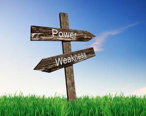 Two road signs against blue sky