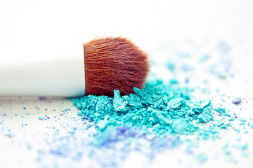 blue eyeshadow make-up powder and brush with shallow dof