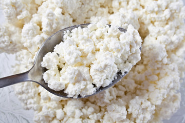 Cottage cheese clods and spoon.