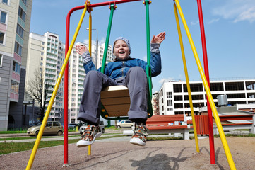 Fototapeta premium A boy on a swing