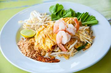 Stir-fried rice noodles with egg and shrimp (Pad Thai)