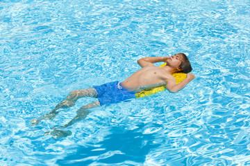boy swimming in the pool