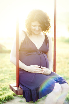 Pregnant swinging