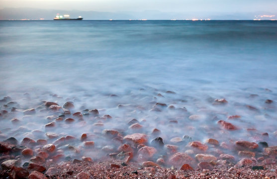 dry cargo ship in Red sea at night, near Aqaba port