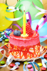 Colorful birthday cake with candle