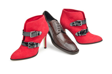 Male and female shoes on white