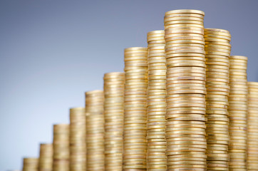 Golden coins in high stacks