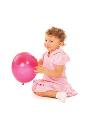 Fototapeta na wymiar A little cute girl with a balloon