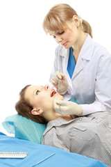 Obraz na płótnie Canvas Dentist examining patient's teeth isolated