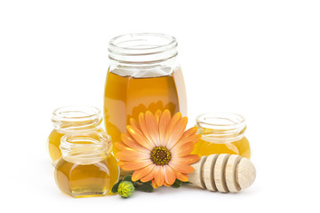 honey and flowers on white