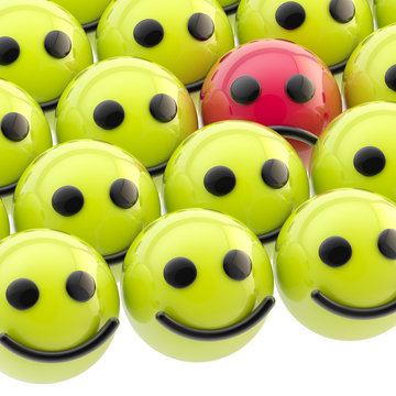 Sad smiley face among happy ones