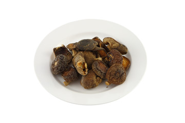 Dry chinese mushroom dish on white background.