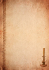 rope and candlestick on old paper parchment