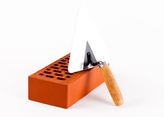 brick and trowel on white background