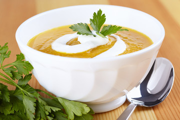 Pumpkin soup in white plate