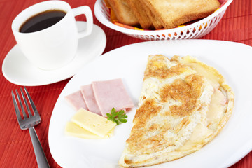 Breakfast. Omelette with cheese and ham