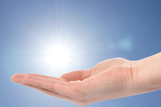 Hand holding the sun