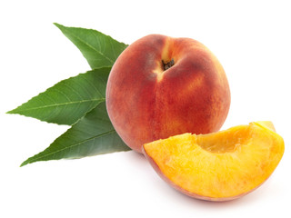 fresh peach fruits with cut and green leaves isolated