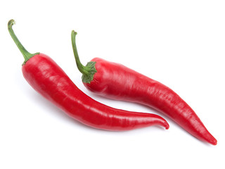 Two red chili peppers isolated on the white