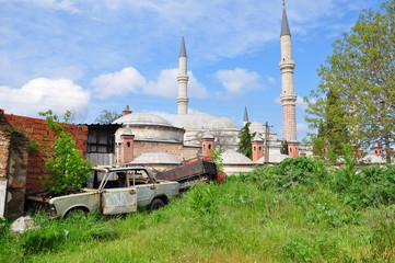 abandoned vehicles back yard of a mosque