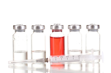 Syringe and medical ampoules isolated on white