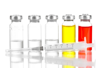Syringe and medical ampoules isolated on white