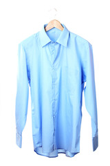 Blue shirt on wooden hanger isolated on white