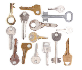 Many metal keys isolated on white