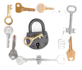 Metal keys and padlock isolated on white
