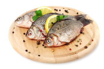 Fresh fishes with lemon, parsley and spice