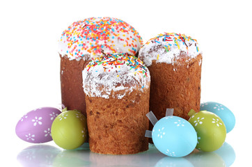 Beautiful Easter cakes and colorful eggs isolated on white