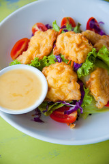 Delicious salad with fish, vegetable and dipping sauce