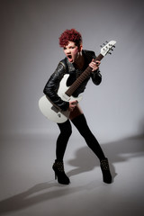 Fototapeta premium Young rock chick singer with guitar