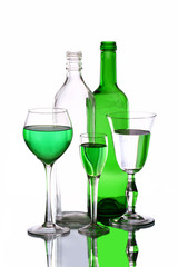 Three wineglasses and two bottles on the mirror