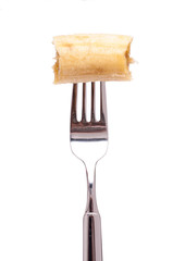 Angebissene Banane auf einer Gabel