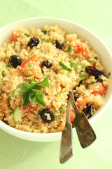 Bowl of quinoa tabbouleh salad with fresh mint