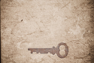 Rusty keys on old paper background