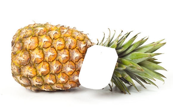 ripe pineapple with a price tag