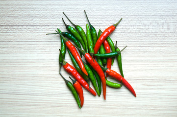 Red peppers on wood background