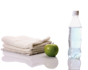 Towel, apple and a bottle with water