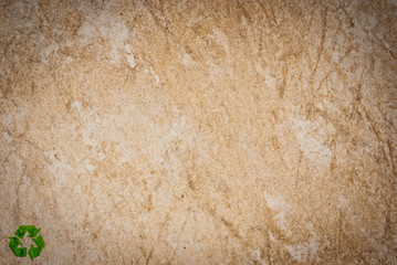 Old paper background. with recyle sign made from green leafs