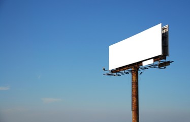 Billboard with empty space shot against a blue sky 