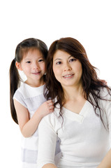Asian mother and her daughter on white background