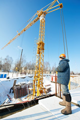 worker with tower crane remote control equipment